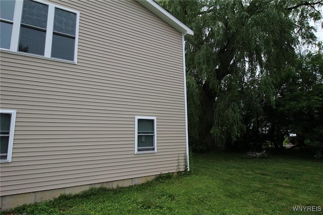 21 Maple St, Evans, NY 14006 - view of home's exterior with a lawn