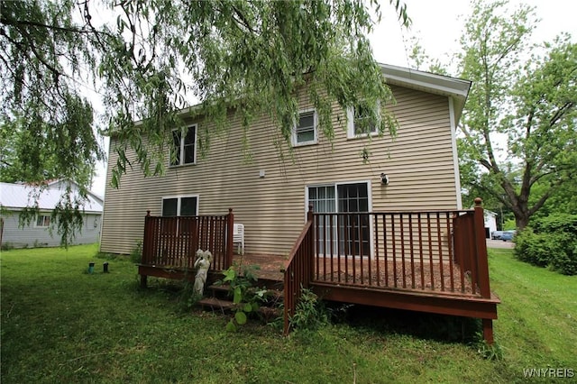 21 Maple St, Evans, NY 14006 - rear view of house featuring a deck and a lawn