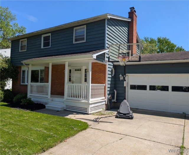 343 Carrollwood Dr, Porter, NY 14174 - view of front facade featuring a porch, concrete driveway, brick siding, a chimney, and a garage