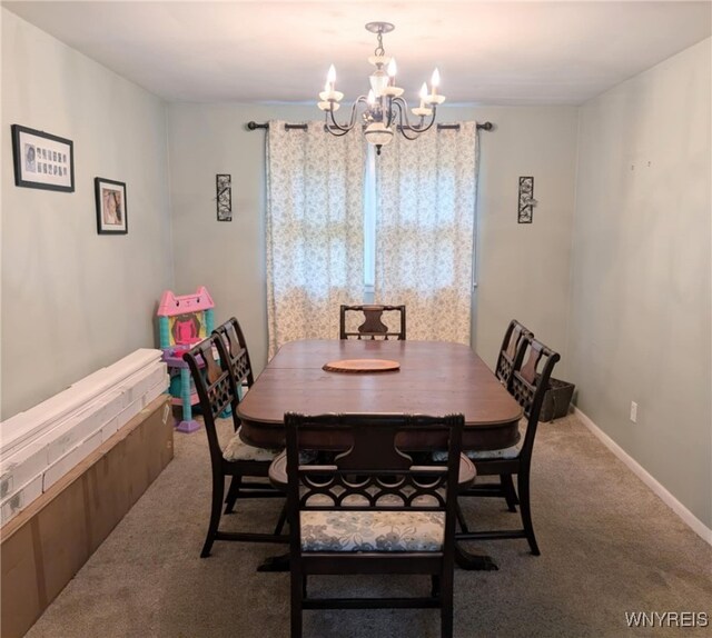 343 Carrollwood Dr, Porter, NY 14174 - carpeted dining area featuring a chandelier and healthy amount of natural light