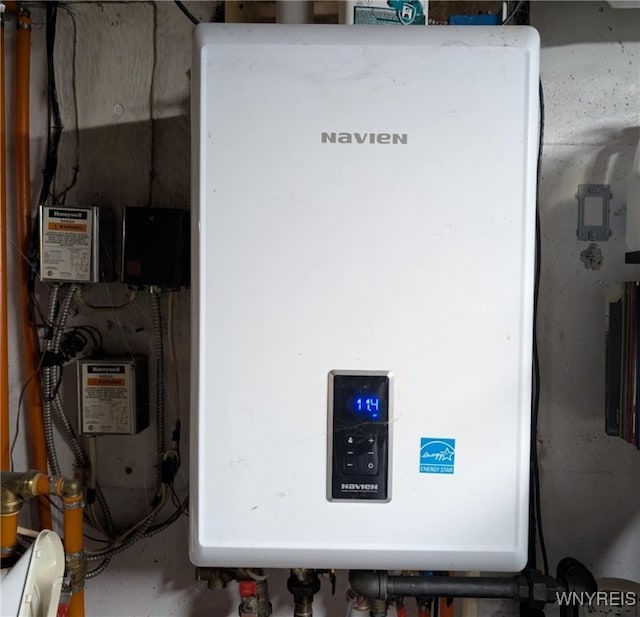 343 Carrollwood Dr, Porter, NY 14174 - utility room featuring tankless water heater