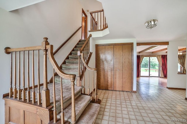2227 W River Rd, Grand Island, NY 14072 - stairs with tile patterned floors and baseboards