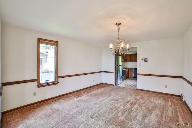 2227 W River Rd, Grand Island, NY 14072 - unfurnished room featuring a chandelier, light colored carpet, and baseboards
