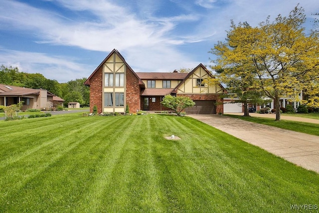 2227 W River Rd, Grand Island, NY 14072 - tudor house with a garage, a front yard, and driveway