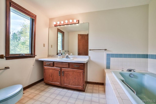 2227 W River Rd, Grand Island, NY 14072 - bathroom with vanity, baseboards, and plenty of natural light