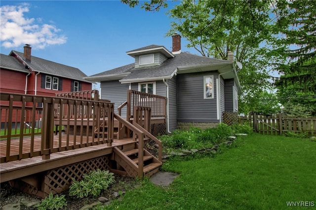 5870 Goodrich Rd, Clarence, NY 14032 - rear view of property featuring a wooden deck, a shingled roof, stairway, and a chimney