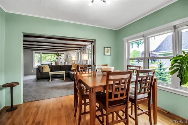 5870 Goodrich Rd, Clarence, NY 14032 - dining space featuring crown molding and light wood-type flooring