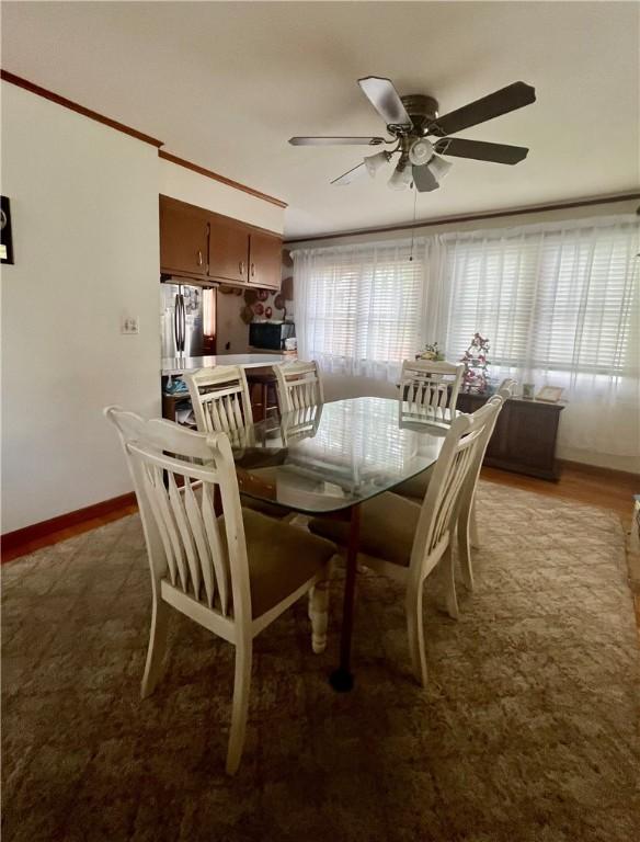 8 Birch St, Oneonta-City, NY 13820 - dining room featuring a ceiling fan and baseboards