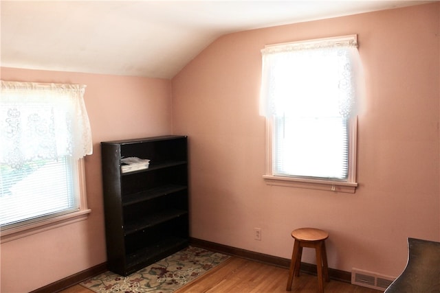 311 N Rogers Pkwy W, Irondequoit, NY 14617 - additional living space featuring vaulted ceiling, light wood-style floors, and baseboards