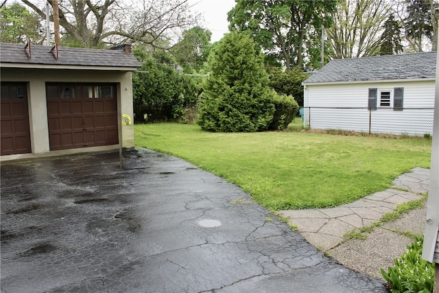 311 N Rogers Pkwy W, Irondequoit, NY 14617 - view of grassy yard featuring a detached garage