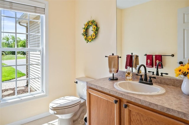1401 Mountain Laurel Ln, Ontario, NY 14519 - half bathroom with vanity, toilet, and healthy amount of natural light