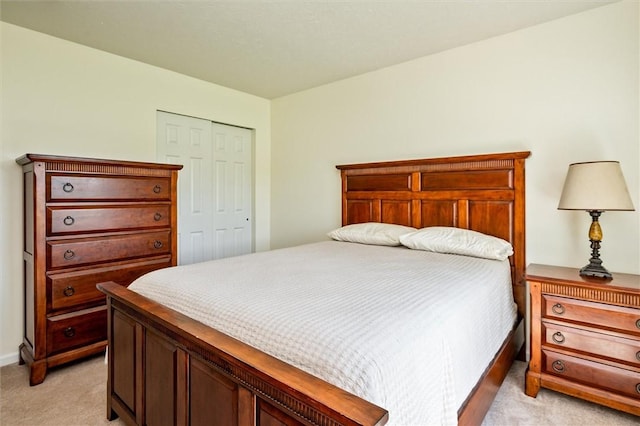 1401 Mountain Laurel Ln, Ontario, NY 14519 - bedroom featuring light carpet, a closet, and baseboards