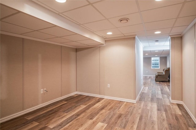 1401 Mountain Laurel Ln, Ontario, NY 14519 - finished below grade area featuring wood finished floors, baseboards, a paneled ceiling, and recessed lighting