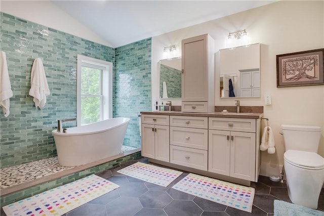 160 Reiss Rd, Otsego, NY 13326 - full bathroom with double vanity, a soaking tub, lofted ceiling, tile patterned floors, and toilet