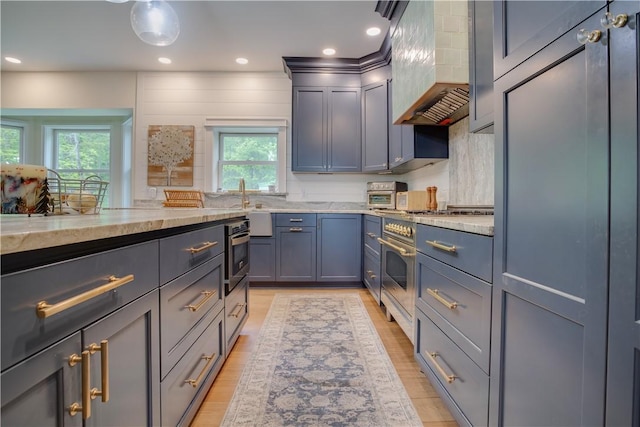 160 Reiss Rd, Otsego, NY 13326 - kitchen with high end stove, light wood-style floors, light stone counters, premium range hood, and recessed lighting