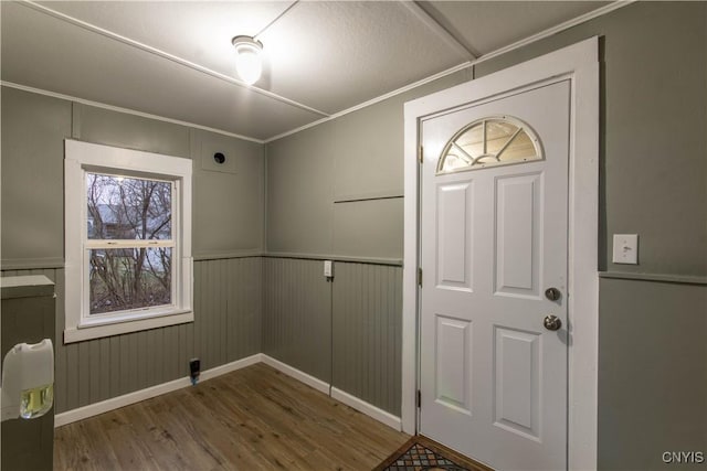 118 Leray St, Le Ray, NY 13612 - foyer entrance with wood finished floors, baseboards, and a decorative wall