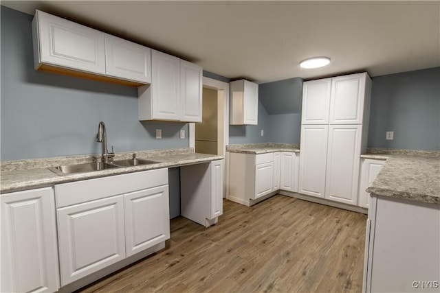 118 Leray St, Le Ray, NY 13612 - kitchen featuring a sink, light wood finished floors, white cabinetry, and light countertops