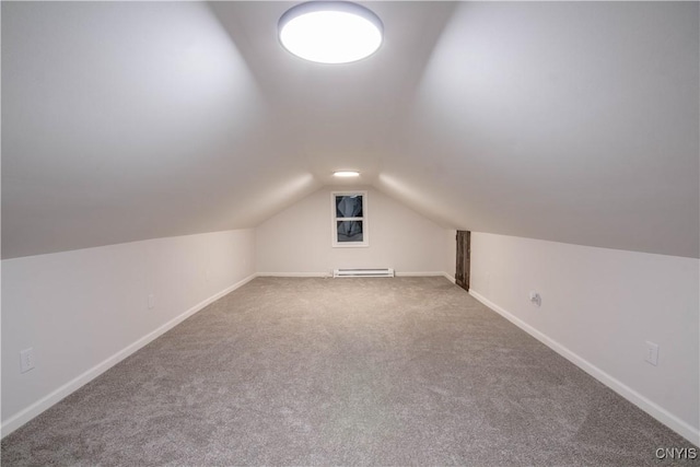 118 Leray St, Le Ray, NY 13612 - bonus room with carpet, vaulted ceiling, a baseboard radiator, and baseboards