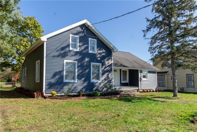 118 Leray St, Le Ray, NY 13612 - view of front facade with covered porch and a front lawn