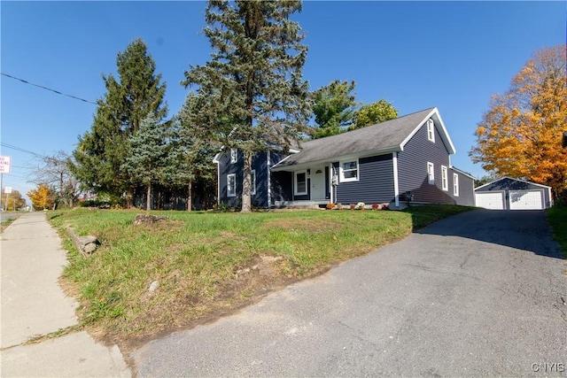 118 Leray St, Le Ray, NY 13612 - view of front of home with an outdoor structure, a garage, and a front yard