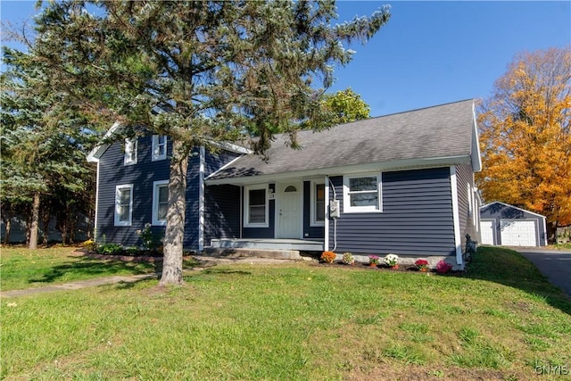 118 Leray St, Le Ray, NY 13612 - view of front of home featuring covered porch, a front lawn, an outbuilding, and a detached garage