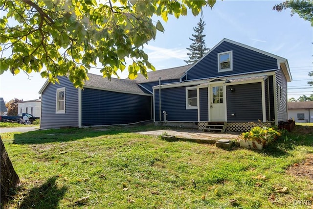 118 Leray St, Le Ray, NY 13612 - back of property featuring entry steps and a yard