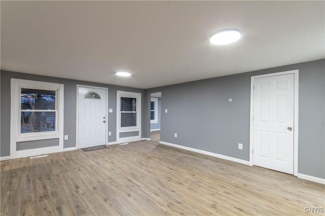 118 Leray St, Le Ray, NY 13612 - foyer featuring baseboards and light wood-style floors