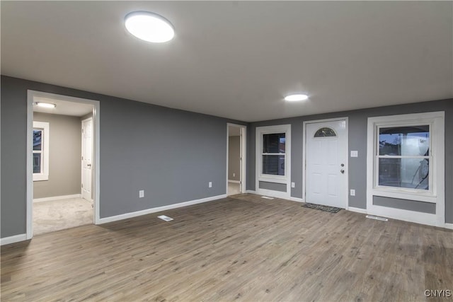 118 Leray St, Le Ray, NY 13612 - foyer entrance featuring wood finished floors and baseboards