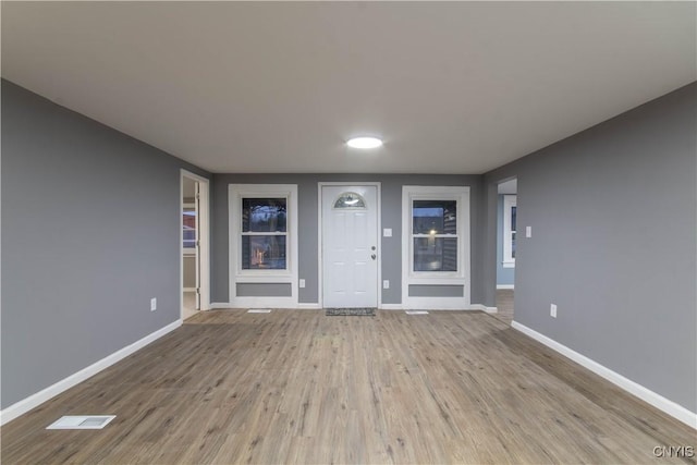 118 Leray St, Le Ray, NY 13612 - foyer with baseboards and wood finished floors