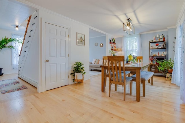 54 Beaver St, Otsego, NY 13326 - dining area featuring light wood-type flooring, stairway, ornamental molding, and baseboards