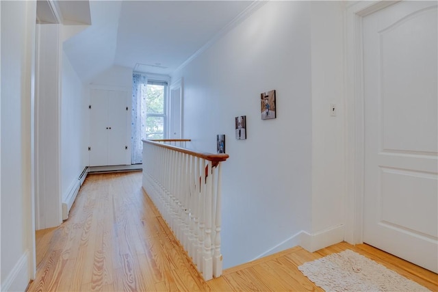 54 Beaver St, Otsego, NY 13326 - hallway featuring light wood-type flooring, an upstairs landing, a baseboard radiator, baseboards, and crown molding
