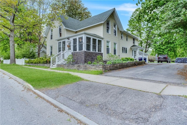 54 Beaver St, Otsego, NY 13326 - view of side of property with a shingled roof, driveway, and stone siding