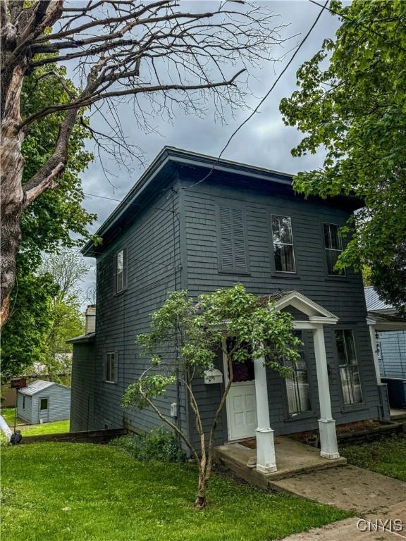 26 Farnham St, Cazenovia, NY 13035 - view of home's exterior with a lawn