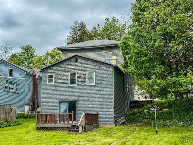 26 Farnham St, Cazenovia, NY 13035 - rear view of house with a deck and a lawn