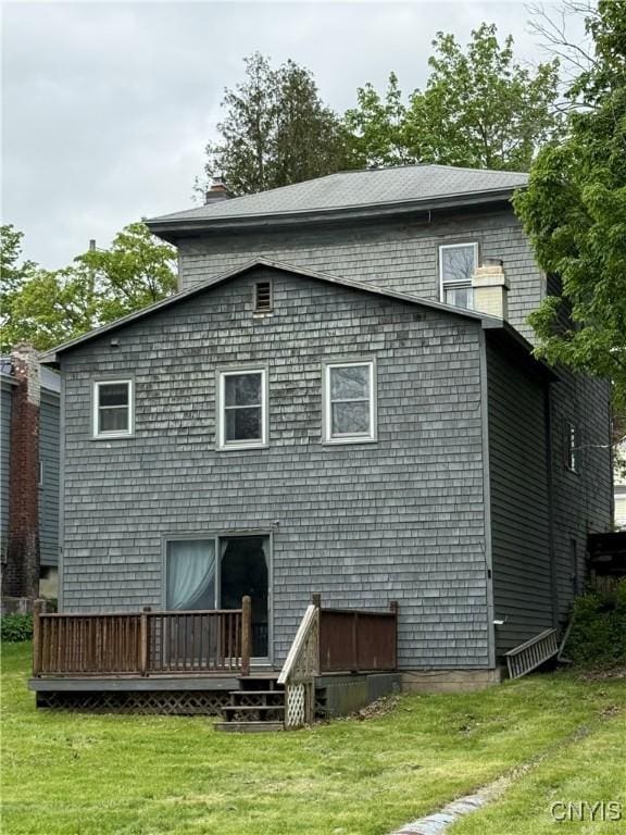 26 Farnham St, Cazenovia, NY 13035 - back of house featuring a wooden deck and a lawn