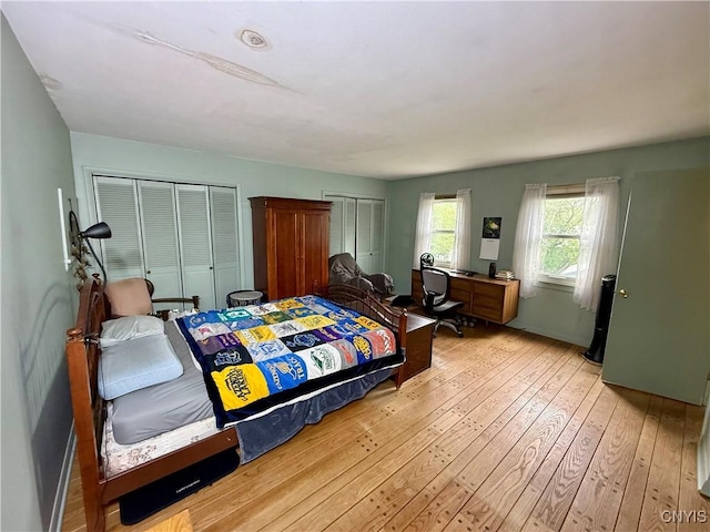 26 Farnham St, Cazenovia, NY 13035 - bedroom featuring hardwood / wood-style flooring and multiple closets