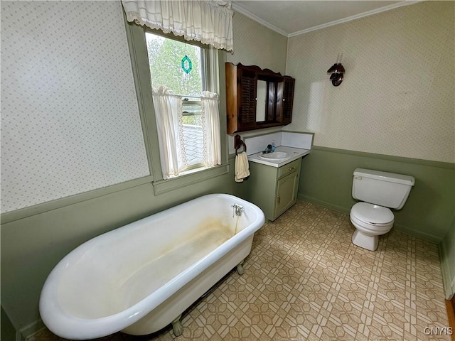 26 Farnham St, Cazenovia, NY 13035 - full bathroom featuring wallpapered walls, a freestanding bath, vanity, ornamental molding, and toilet