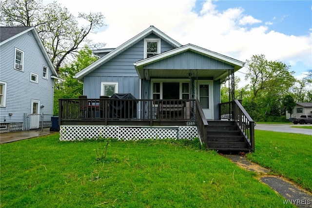 3564 Grafton Ave, Hamburg, NY 14219 - view of front of property featuring a front yard, board and batten siding, and covered porch