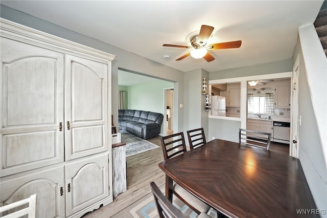 3564 Grafton Ave, Hamburg, NY 14219 - dining area with a ceiling fan and light wood-style floors