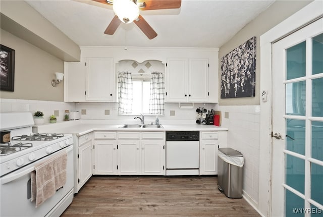 3564 Grafton Ave, Hamburg, NY 14219 - kitchen featuring white appliances, a sink, white cabinetry, light countertops, and wainscoting