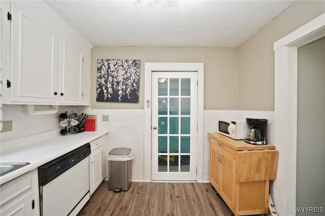 3564 Grafton Ave, Hamburg, NY 14219 - kitchen featuring white appliances, white cabinetry, wood finished floors, tile walls, and wainscoting