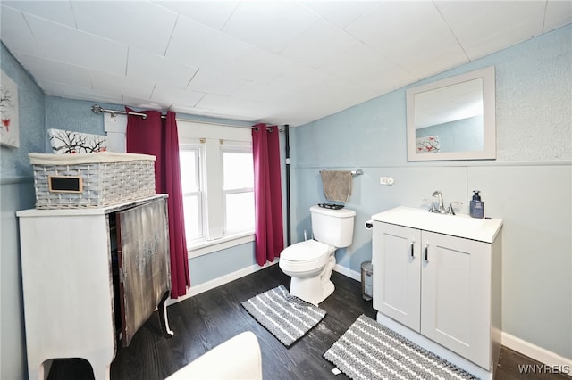 3564 Grafton Ave, Hamburg, NY 14219 - bathroom with toilet, vanity, and wood finished floors