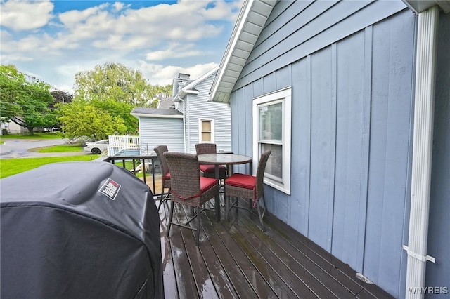 3564 Grafton Ave, Hamburg, NY 14219 - wooden deck with area for grilling and outdoor dining area