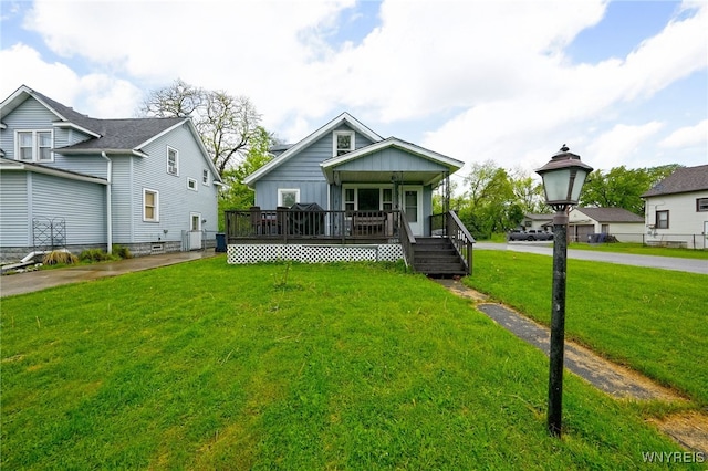 3564 Grafton Ave, Hamburg, NY 14219 - view of front facade featuring a front lawn, a porch, and central AC unit
