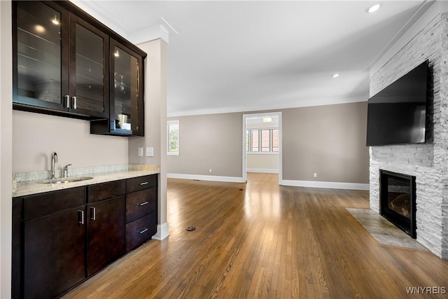 13 Ojibwa Cir, Buffalo, NY 14202 - indoor bar with wood finished floors, a fireplace, baseboards, and crown molding