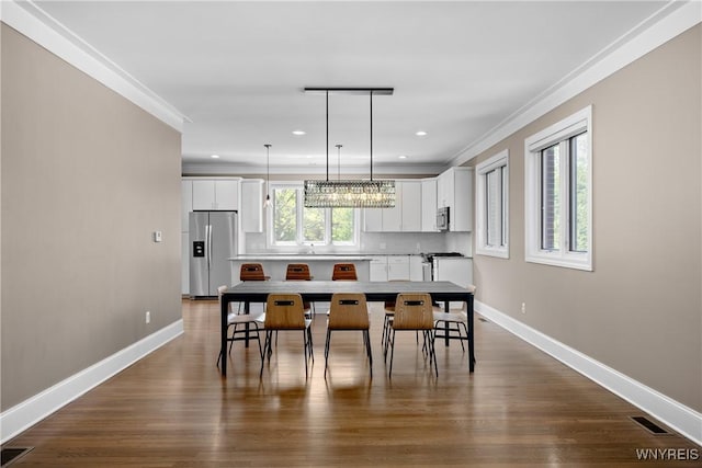 13 Ojibwa Cir, Buffalo, NY 14202 - dining room with baseboards, a chandelier, recessed lighting, ornamental molding, and dark wood finished floors