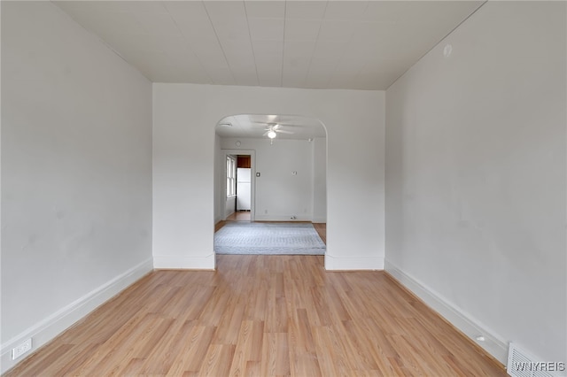 151 Edson St, West Seneca, NY 14210 - unfurnished room with arched walkways, light wood-style flooring, baseboards, and a ceiling fan