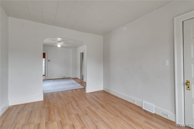 151 Edson St, West Seneca, NY 14210 - unfurnished room with arched walkways, light wood-style floors, and baseboards