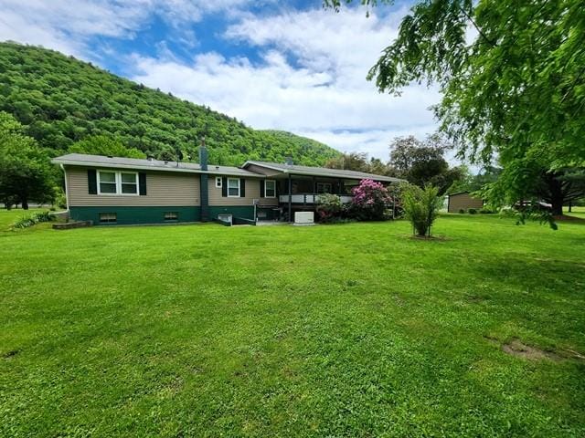 3483 First Fork Rd, Grove Twp, PA 15861 - rear view of property with a yard and a sunroom