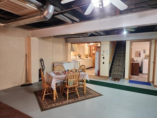 3483 First Fork Rd, Grove Twp, PA 15861 - finished below grade area with freestanding refrigerator, stairway, washer / clothes dryer, and ceiling fan